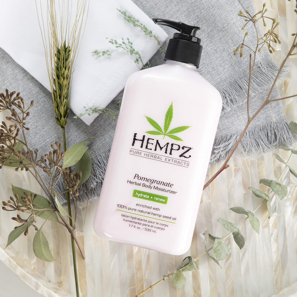 Hempz body lotion pomegranate texture on skin, conveying quick-absorb hydration without residue.