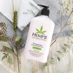Hempz body lotion pomegranate texture on skin, conveying quick-absorb hydration without residue.