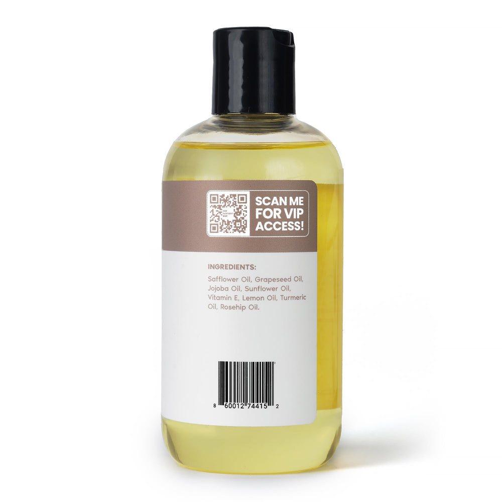 Her Fantasy Box body oil vitamin-e turmeric ingredient close-up suggests soothing nourishment.