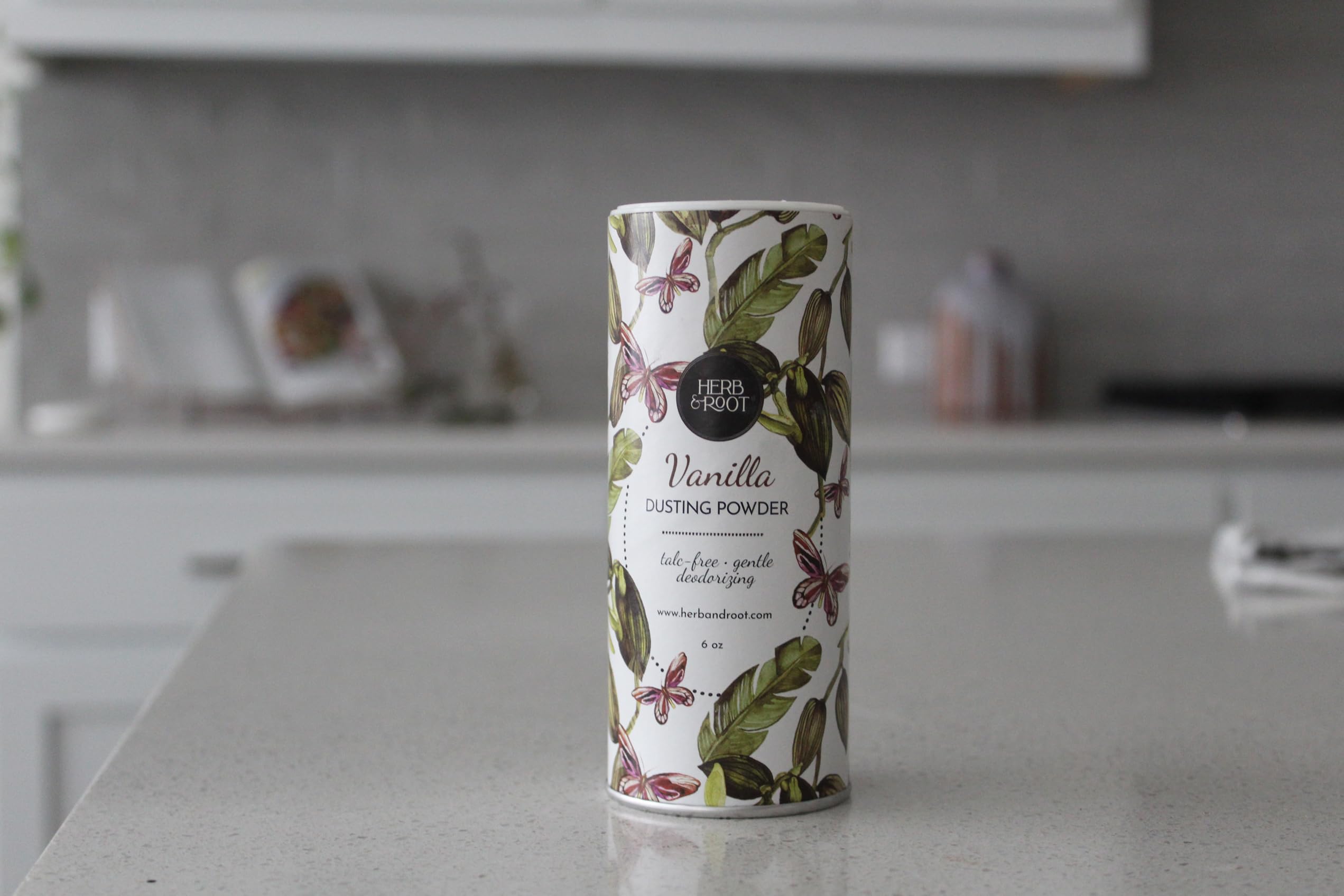 Herb & Root jasmine tin highlights fresh scent and gentle matte finish.