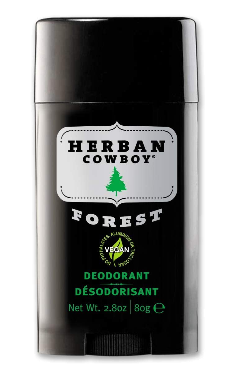 Woodsy background for Herban Cowboy Forest Deodorant evokes nature-inspired scent.