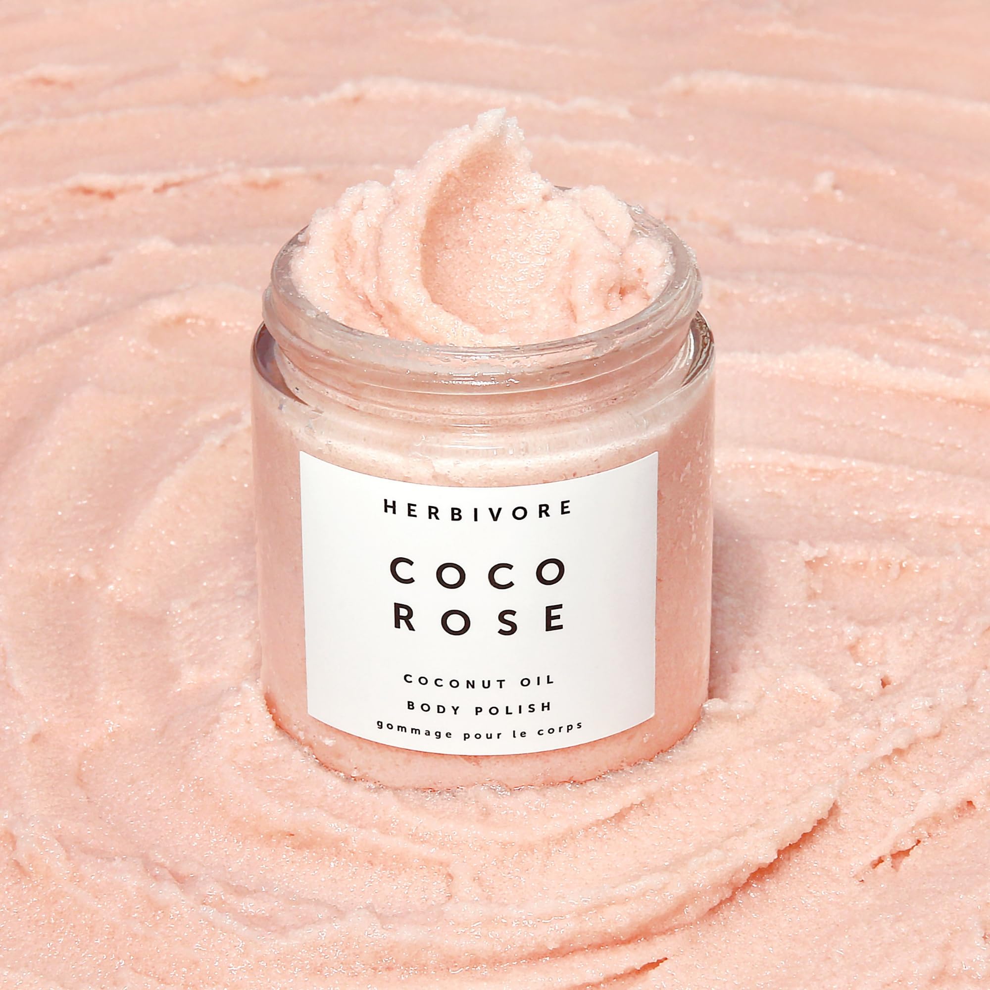 Close-up of Coco Rose scrub texture for gentle polish.