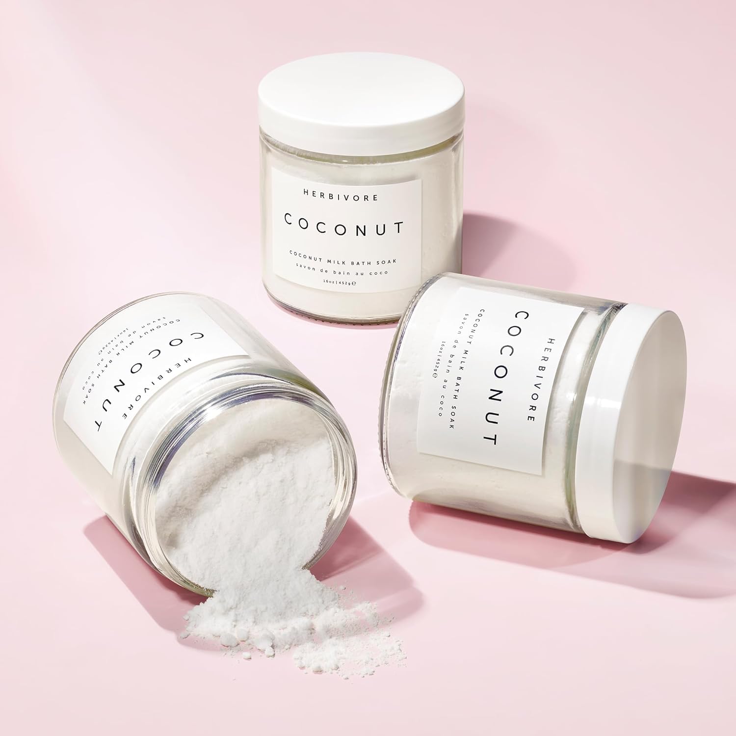 HERBIVORE Coconut Milk Bath Soak texture close-up highlights creamy nourishing bath suspension