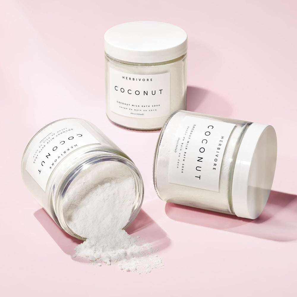 HERBIVORE Coconut Milk Bath Soak texture close-up highlights creamy nourishing bath suspension