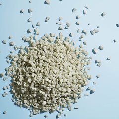 HERBIVORE Detox Soaking Salts Cambrian Blue Clay close-up highlighting detoxifying clay properties.