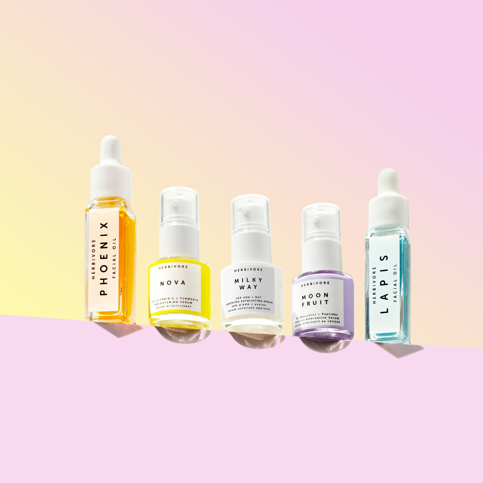HERBIVORE Rainbow Minis Set Lapis oil bottle—color-rich hydration for calm, even-toned skin.