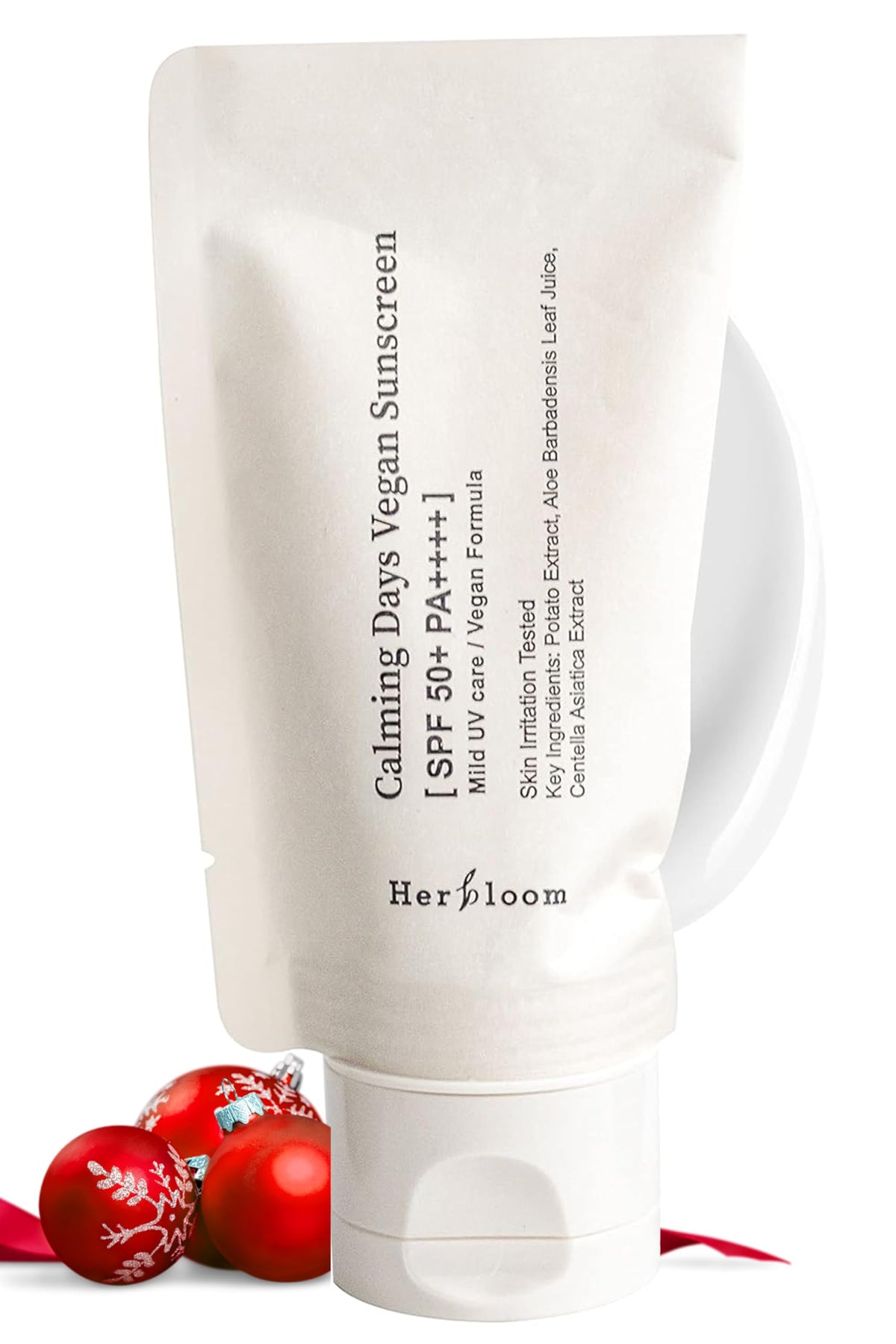 Herbloom Calming Days sunscreen bottle close-up highlighting lightweight, non-greasy hydration with SPF 50+ PA++++
