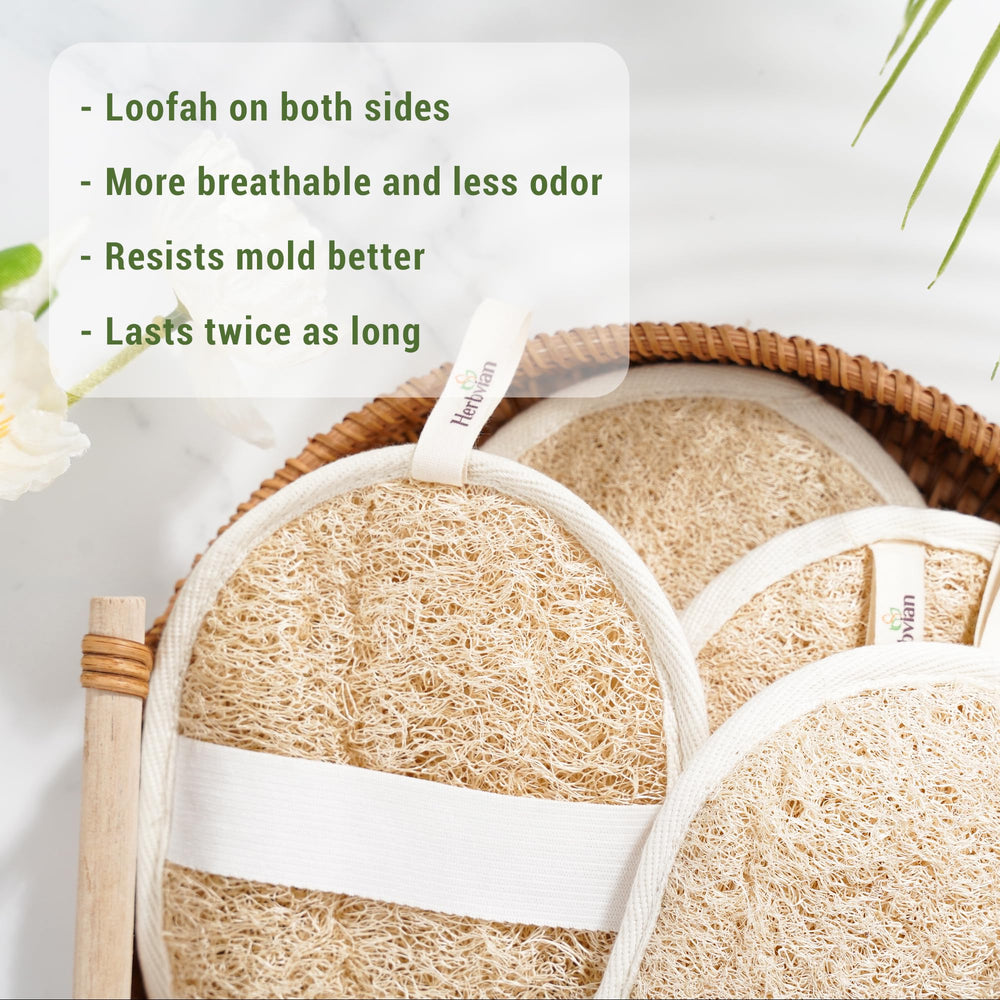 Herbvian loofah pads during wet use highlights gentle exfoliation with soap.