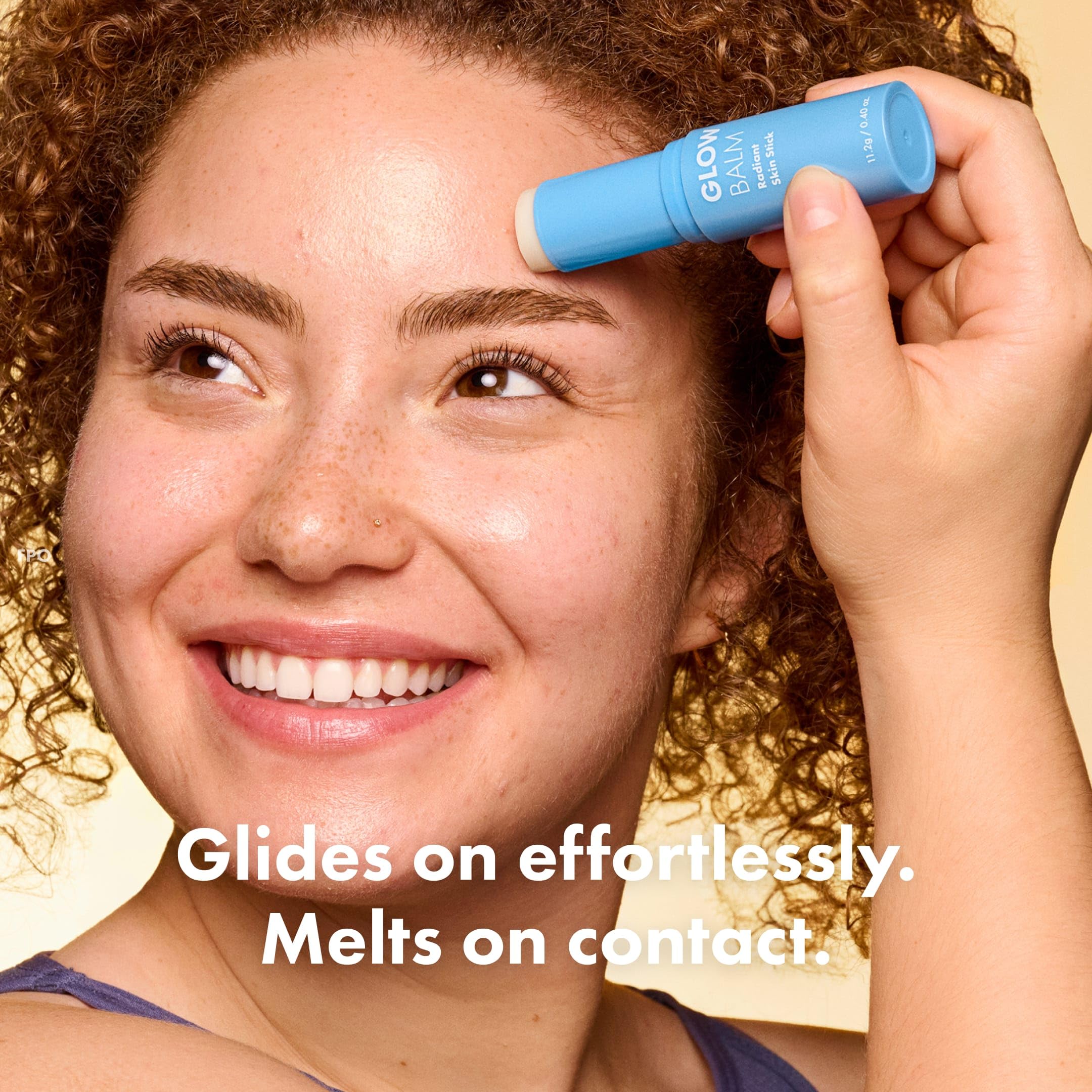 Hero Cosmetics Glow Balm on forehead highlights natural glow for daily radiance.