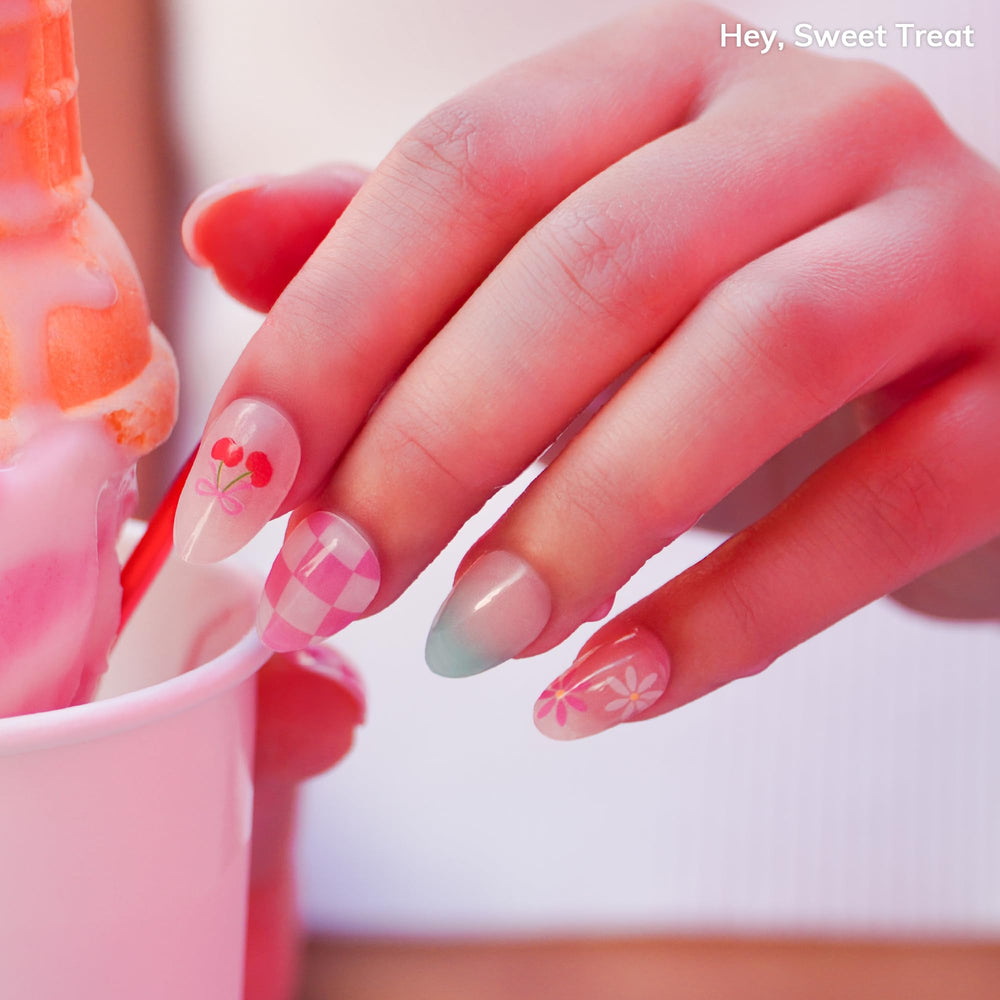 Heyhae Sweet Treat strip application on nails for easy, smooth results.