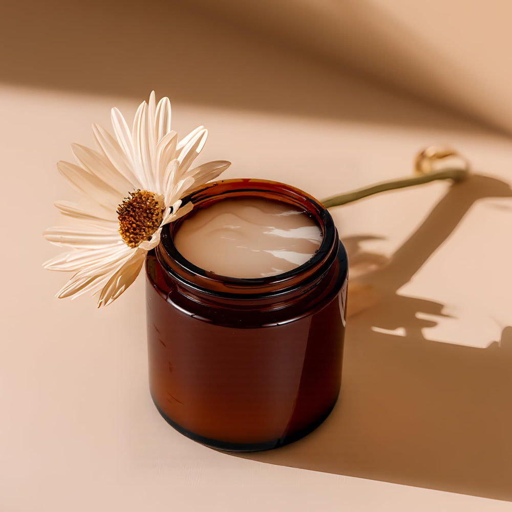 Hoa Kinh amber glass jar lid-off top view shows easy-seal design for creams.