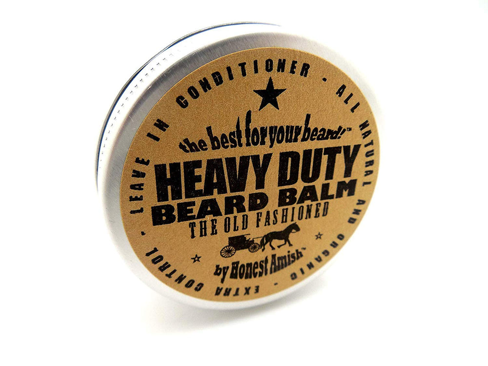 Honest Amish heavy-duty beard balm 2oz label close-up highlighting natural ingredients.