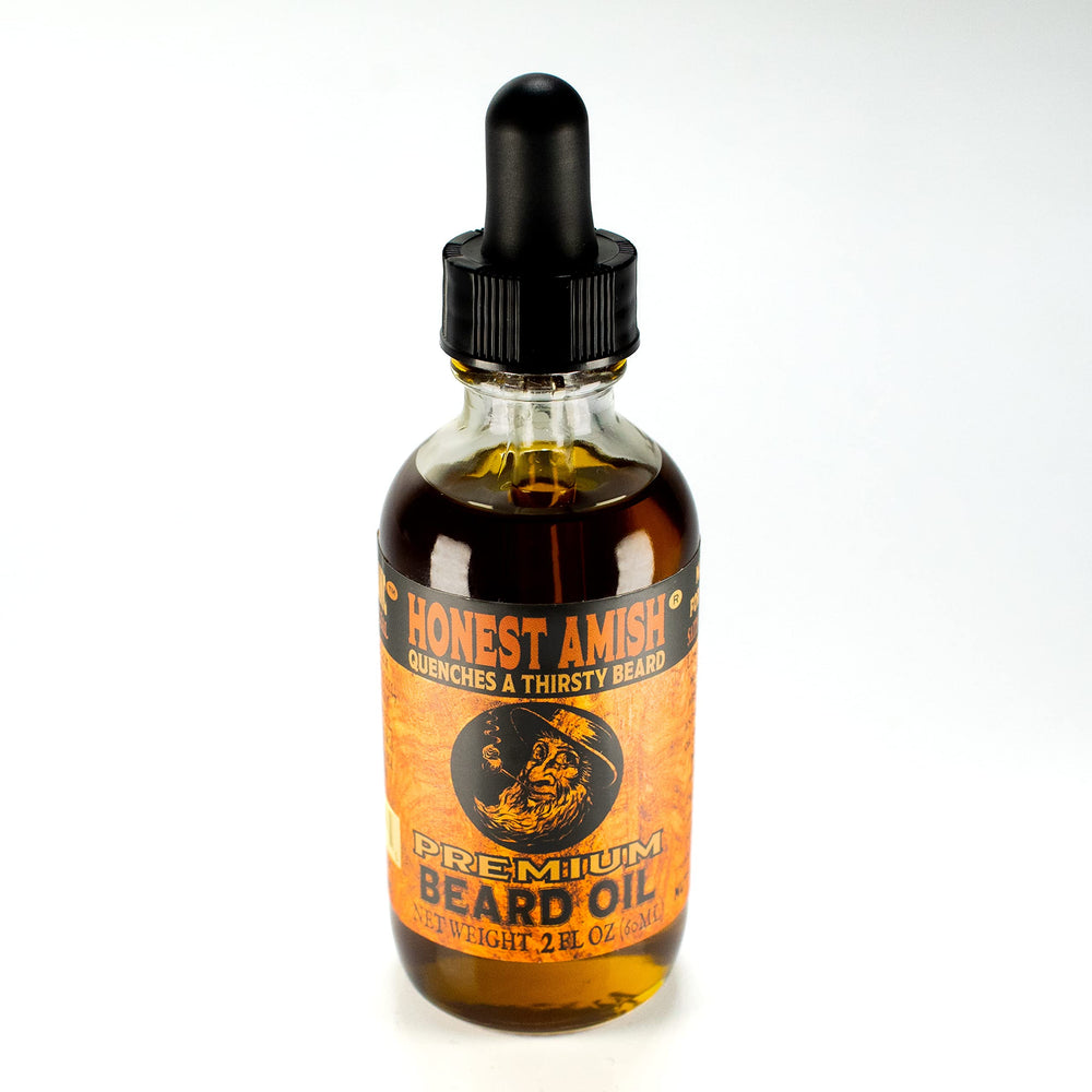 Honest Amish Premium Beard Oil 2oz pour demonstrates easy dropper application for grooming.