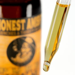 Honest Amish Pure Beard Oil label closeup highlights natural ingredients.