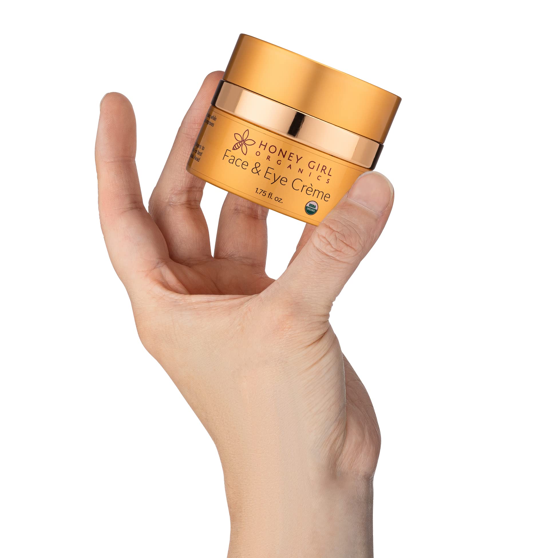 Honey Girl Organics Face & Eye Creme being applied to the eye area demonstrates gentle daily care.