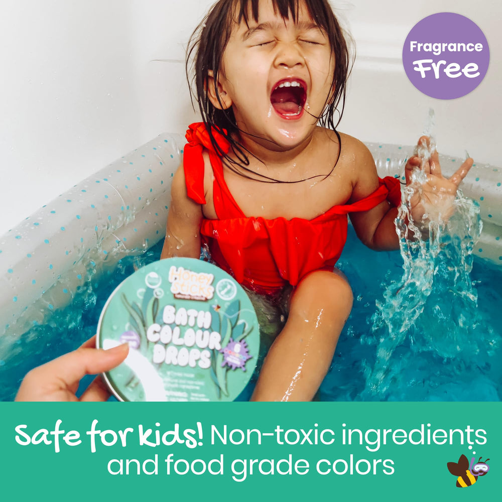 Honeysticks Bath Color Drops fizzing in water creates vibrant color.