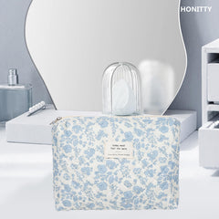 Honitty floral-pattern bag with upgraded zipper offers smooth access to supplies.