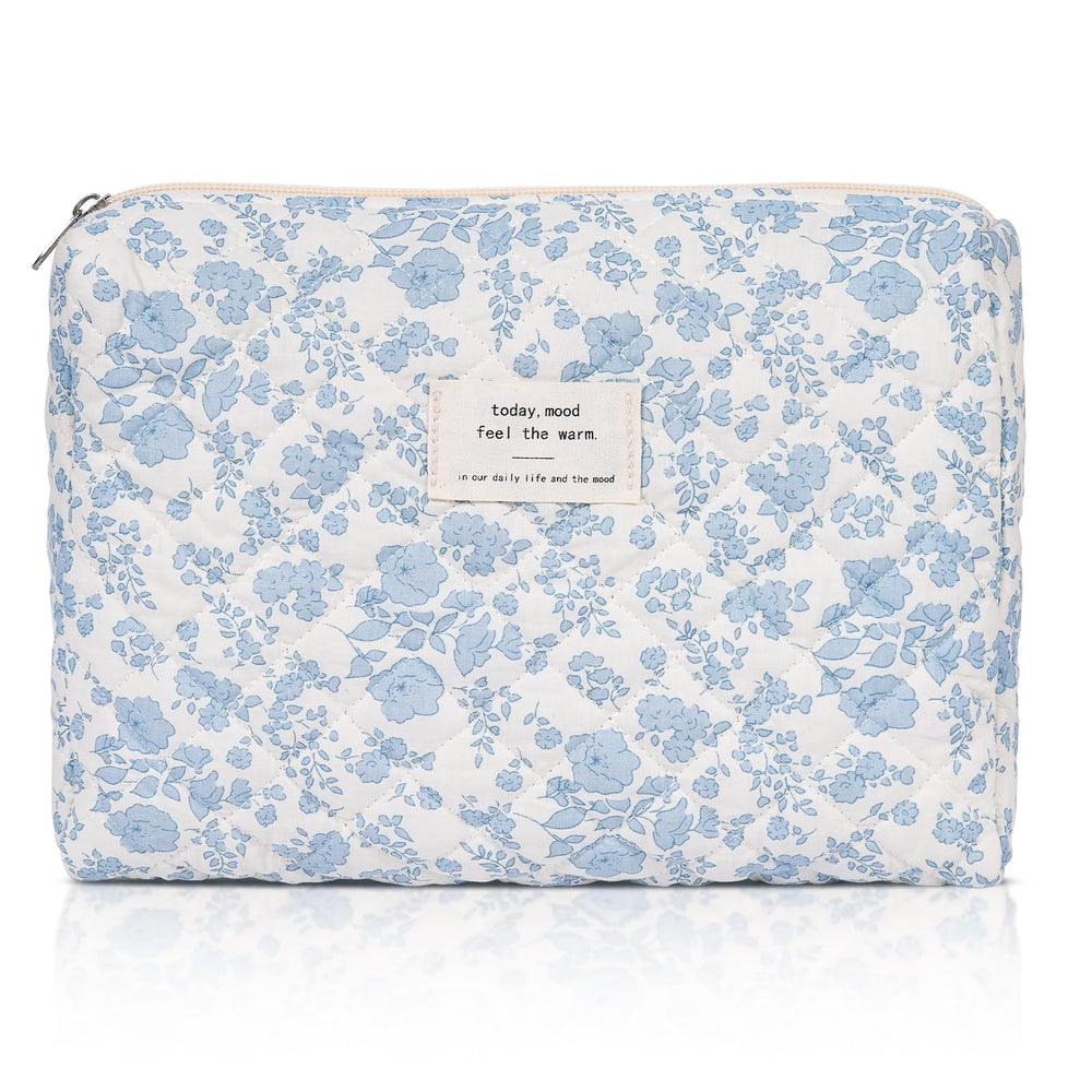 Honitty makeup pouch with quilted floral pattern keeps cosmetics organized while traveling.
