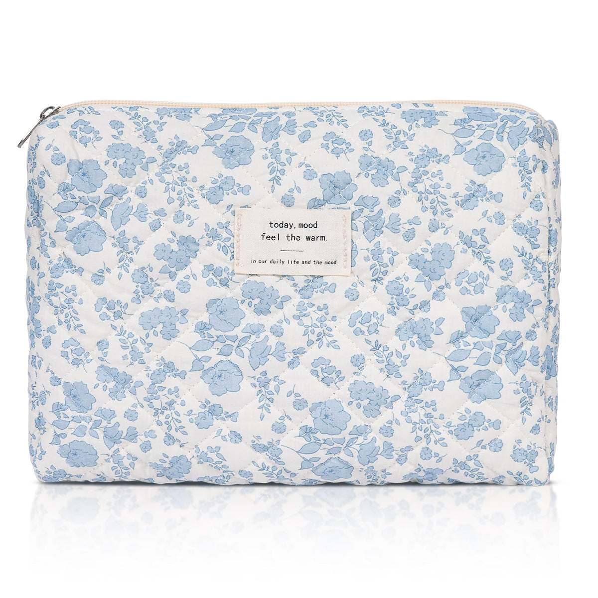 Honitty makeup pouch with quilted floral pattern keeps cosmetics organized while traveling.