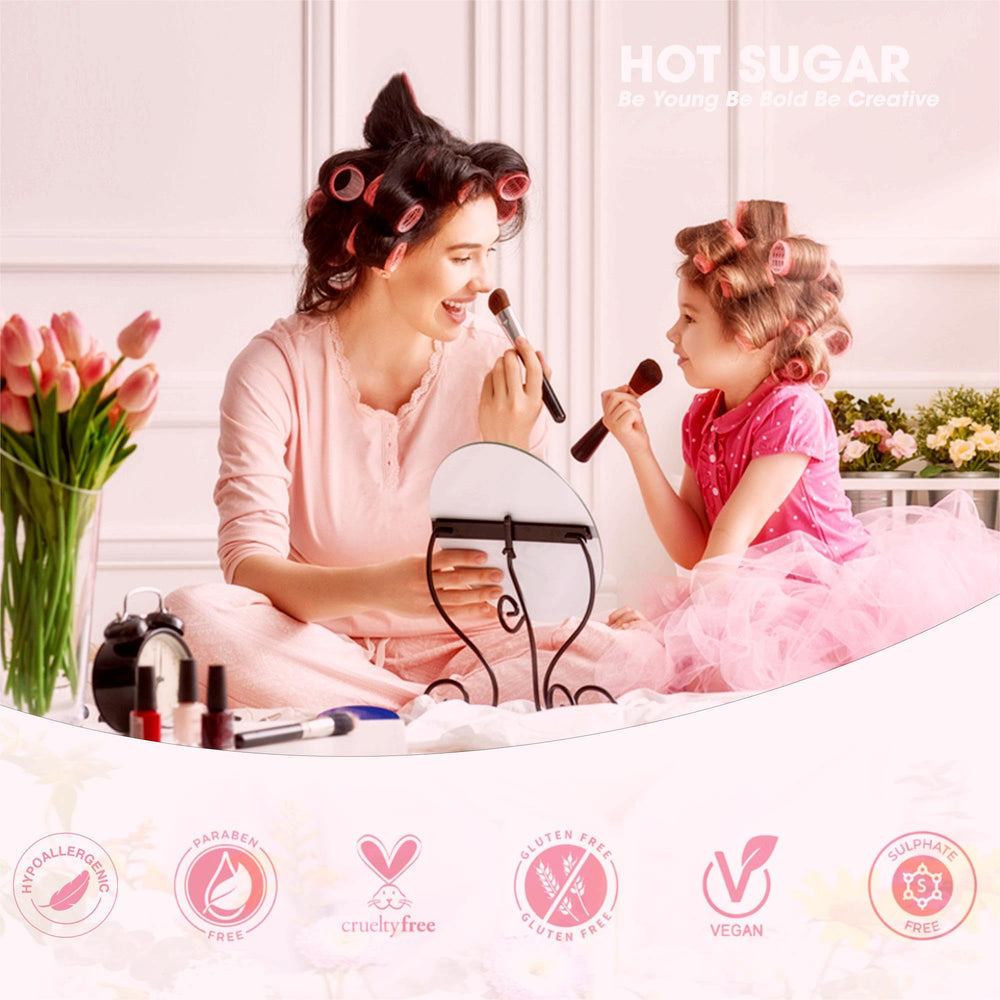 Hot Sugar lip glosses and lipsticks set on a mirror-lit vanity for bold experiments.