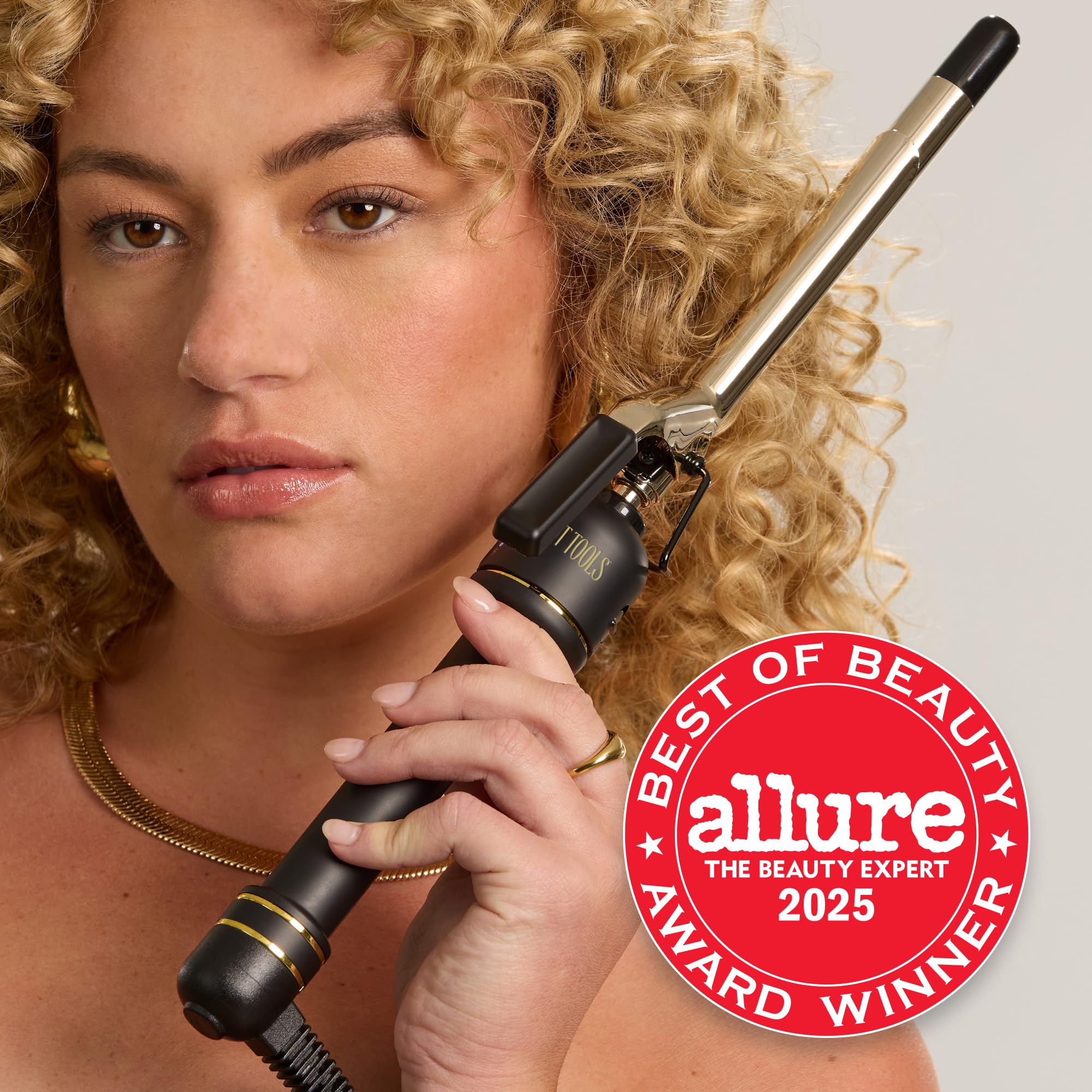 HOT TOOLS 24K Gold curling iron clamp in action styling smooth ringlets