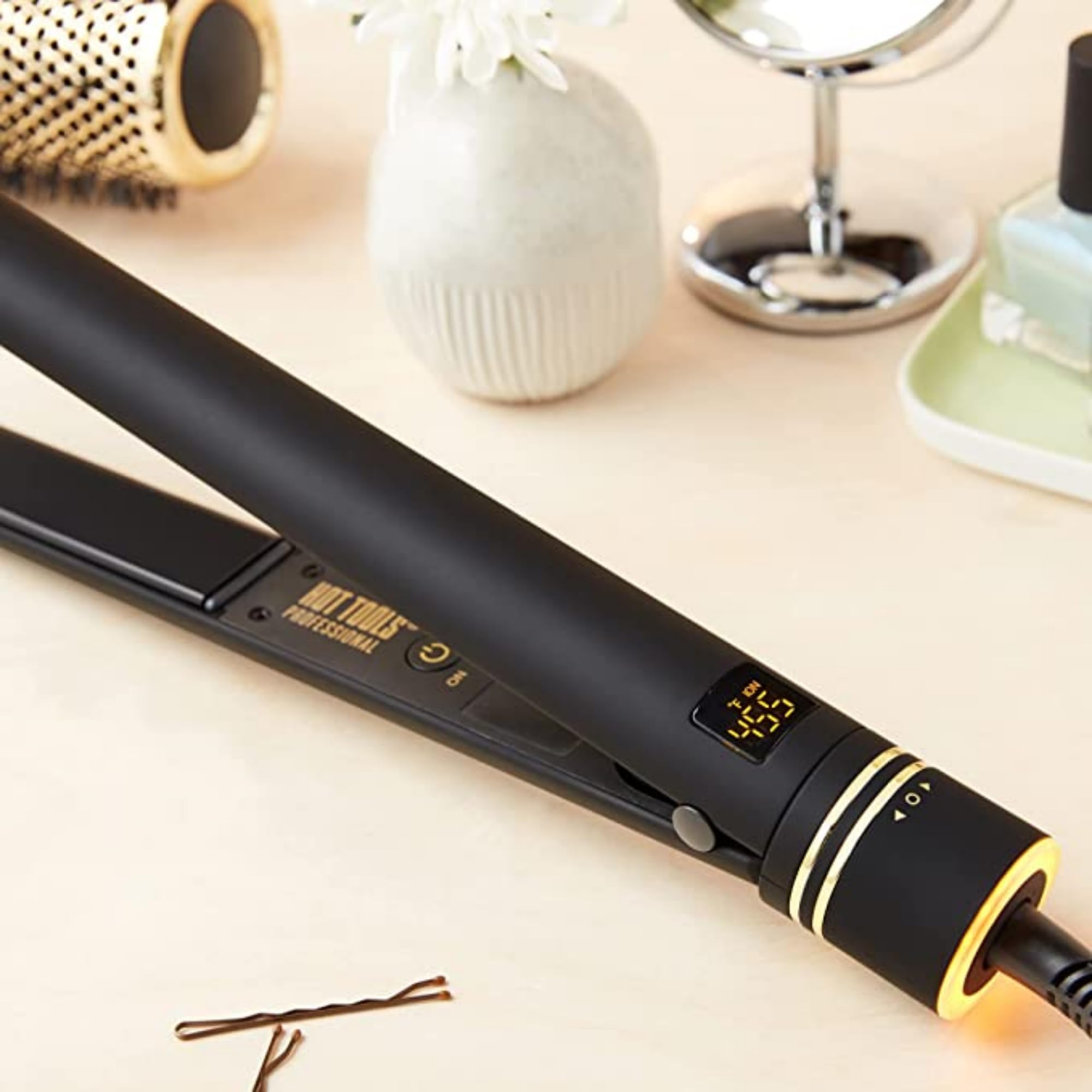 Hot Tools Pro Artist Black Gold 1in flat iron included glove supports safe handling.