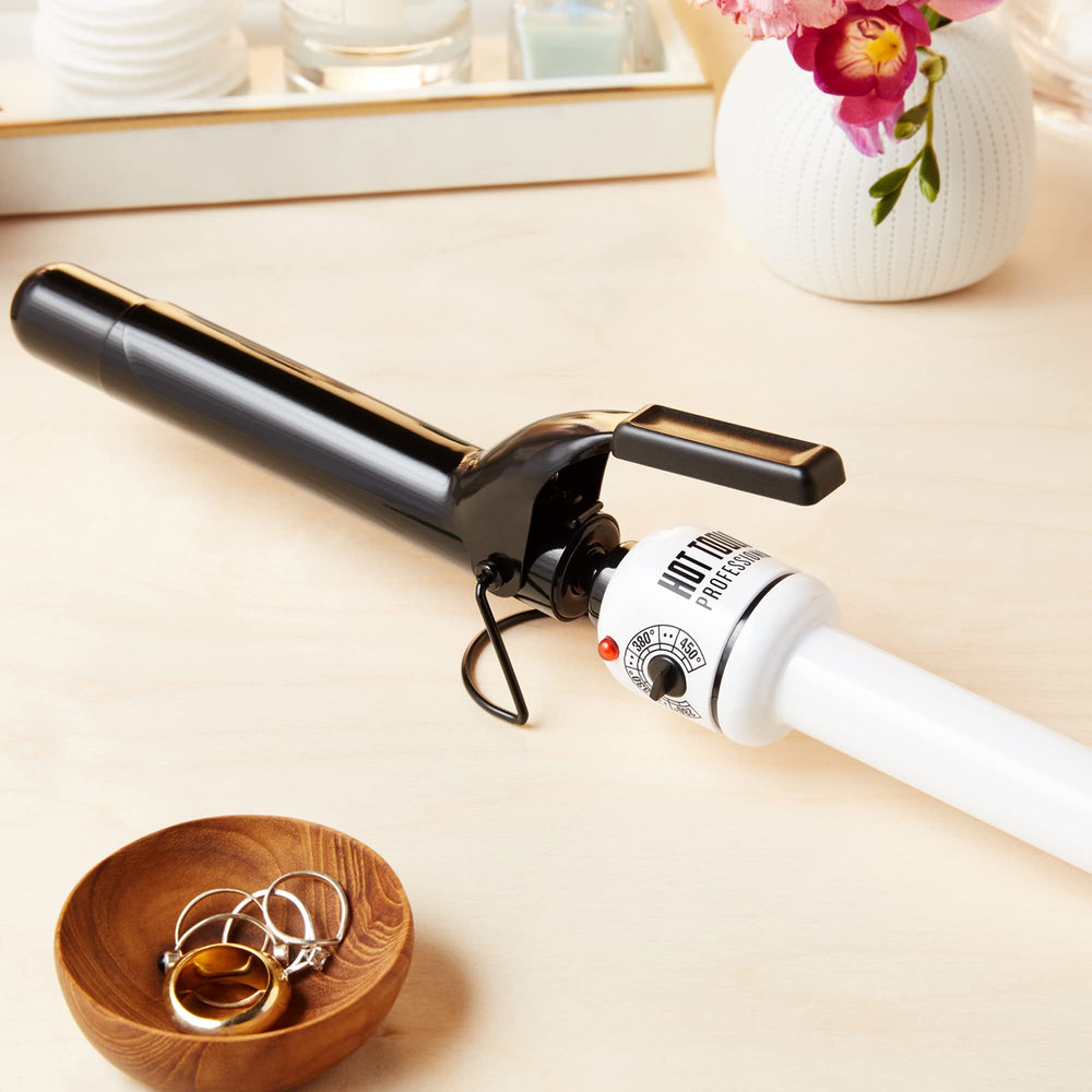 Hot Tools Pro Artist Nano Ceramic Curling Iron wand foldaway stand demonstrates easy storage.