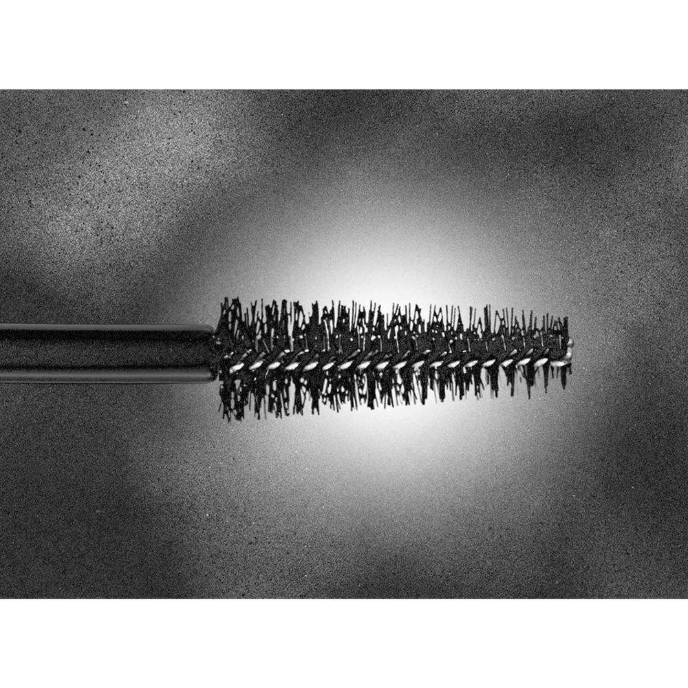 Hourglass Caution Extreme Lash Mascara wand applied to lashes for long-wear definition