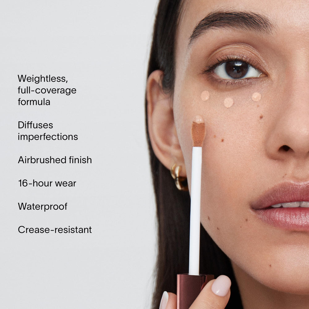 Hourglass Vanish Airbrush Concealer on face demonstrates smooth blending for even skin.
