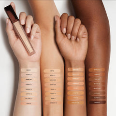 Hourglass Vanish Airbrush Concealer soft-focus powder blurs pores for camera-ready skin.