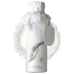 House of Dohwa Rice Bran Powder Wash label closeup, signaling gentle exfoliation for refined skin