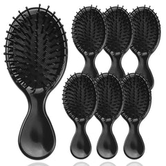 HQSLsund mini hair brush close-up showing matte black handle for gentle detangling
