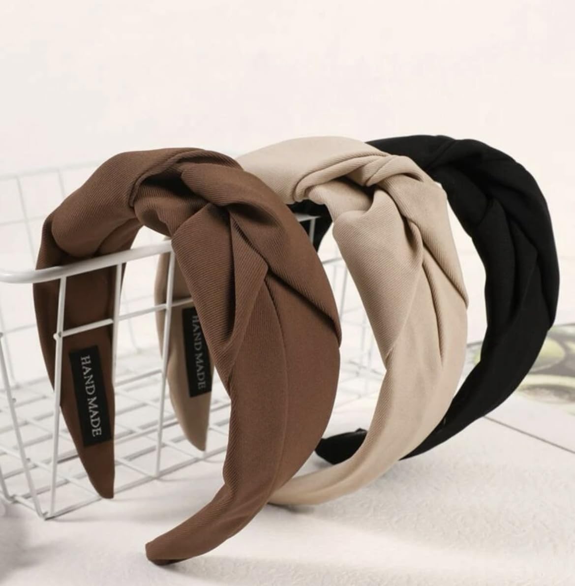 Huachi knotted headbands black on head for secure non-slip wear.