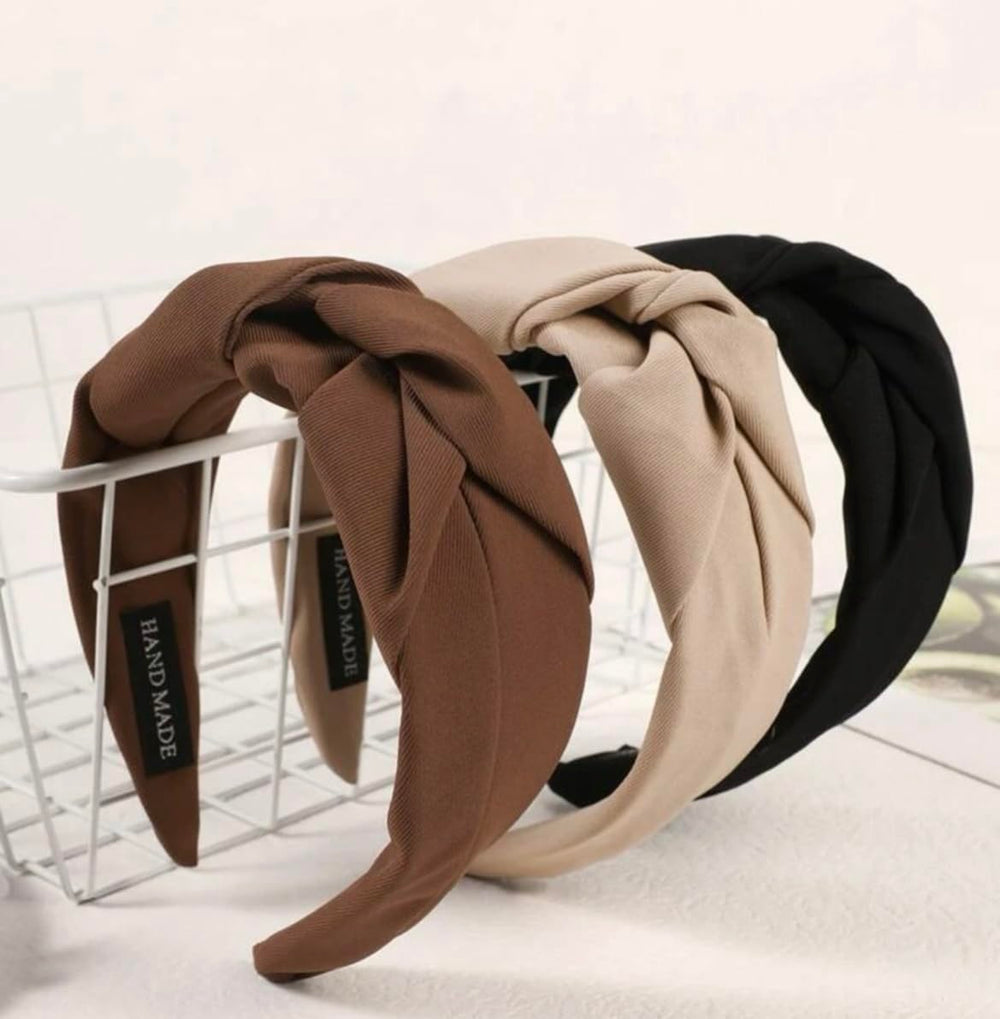 Huachi knotted headbands black on head for secure non-slip wear.