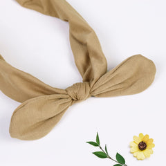 Huachi turban-style headband elastic demonstrates secure fit for workouts or busy days.