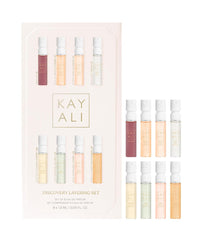Huda KAYALI Discovery Layering Set packaging showcases eight mini EDP samplers for versatile scent layering.