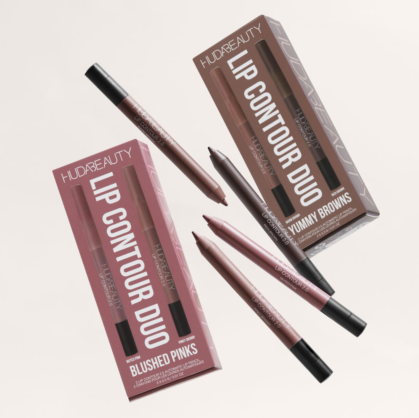Huda Lip Contour Duo side-by-side pink tones illustrate versatile lip contouring options.