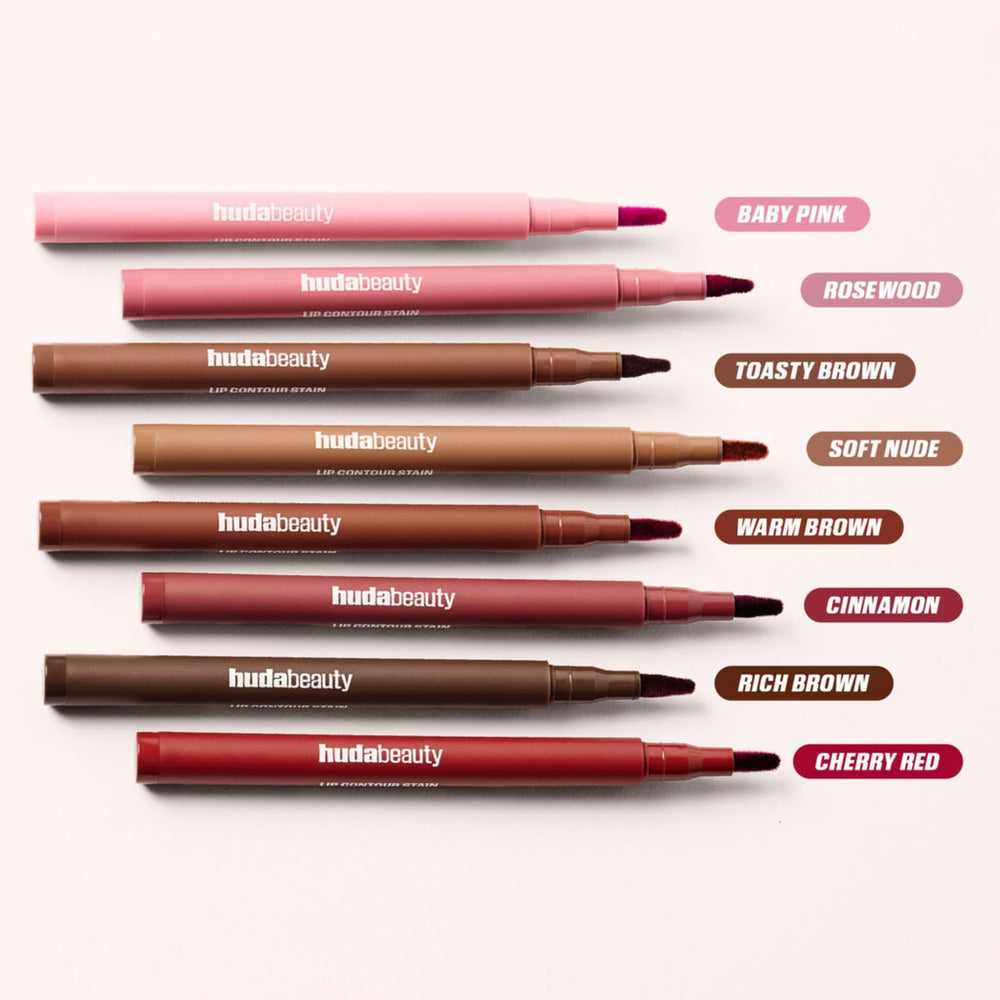 Huda Lip Contour Stain Warm Brown pigment on lips with subtle glow.