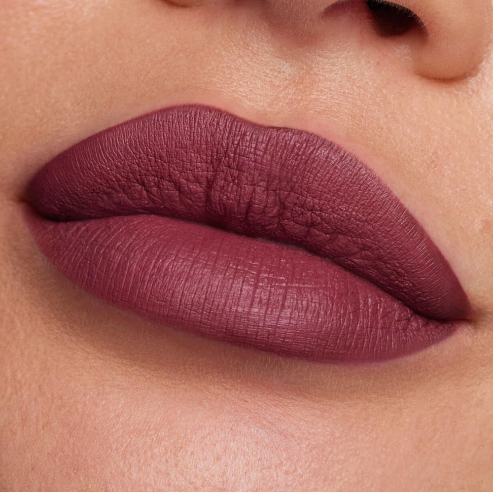 Huda Beauty Trophy Wife lipcolor variation demonstrates shade adaptability for multiple skin tones.