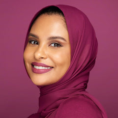 Huda Beauty Trophy Wife rose wood lip color closeup highlights rich pigment and warm tone.