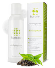 Humane Clarifying Toner bottle on surface for refreshing pores and skin