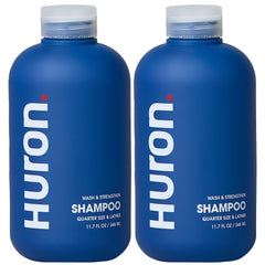 Huron Clean Citrus Woods shampoo bottle with invigorating citrus scent for daily refreshment