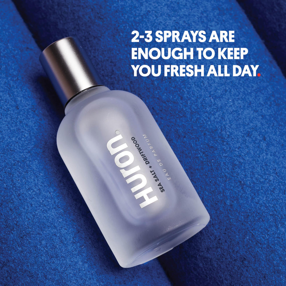 Huron Men’s Cologne packaging shot showcasing sleek glass bottle and design.