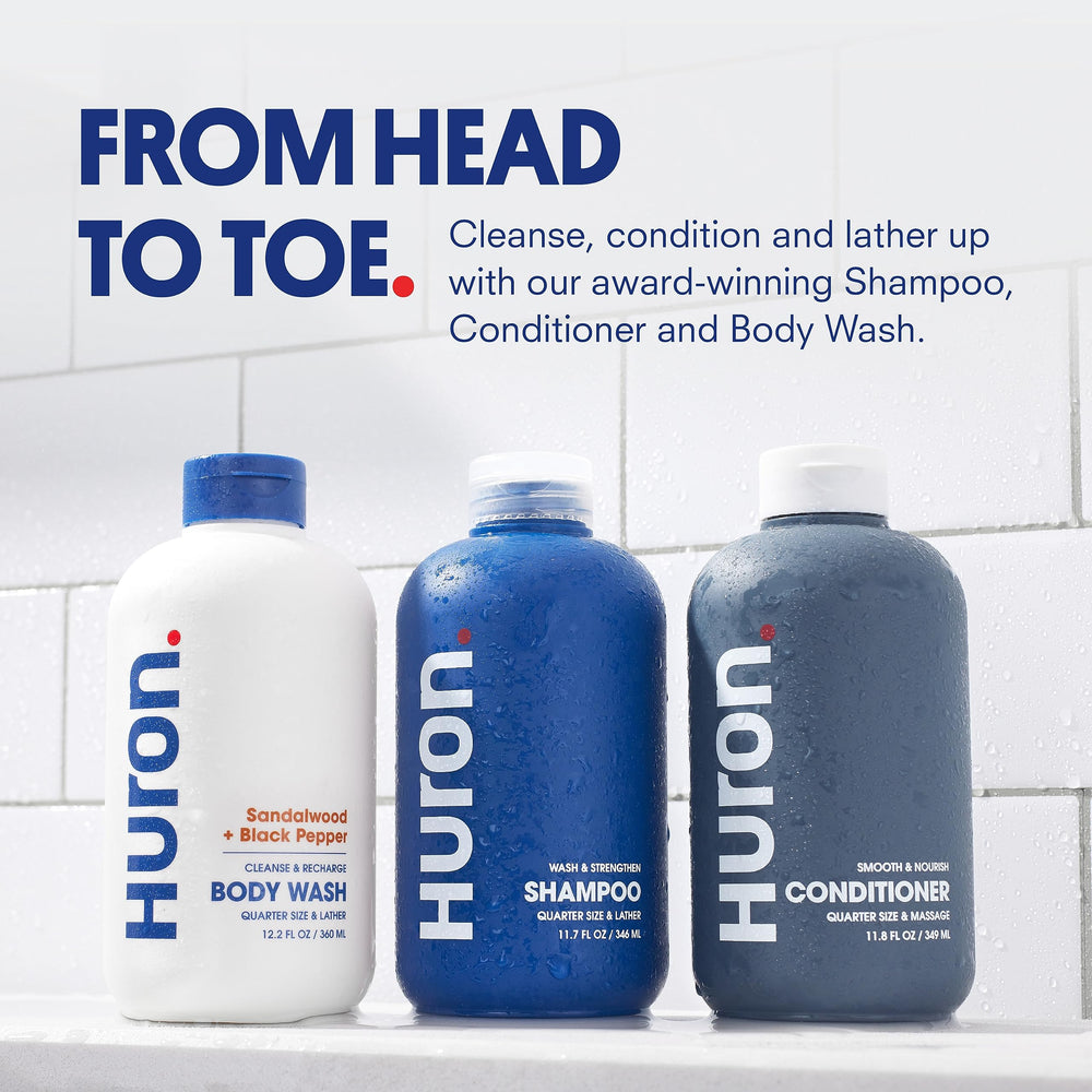 Huron Shower Kit conditioner bottle helps tame frizz and add moisture.