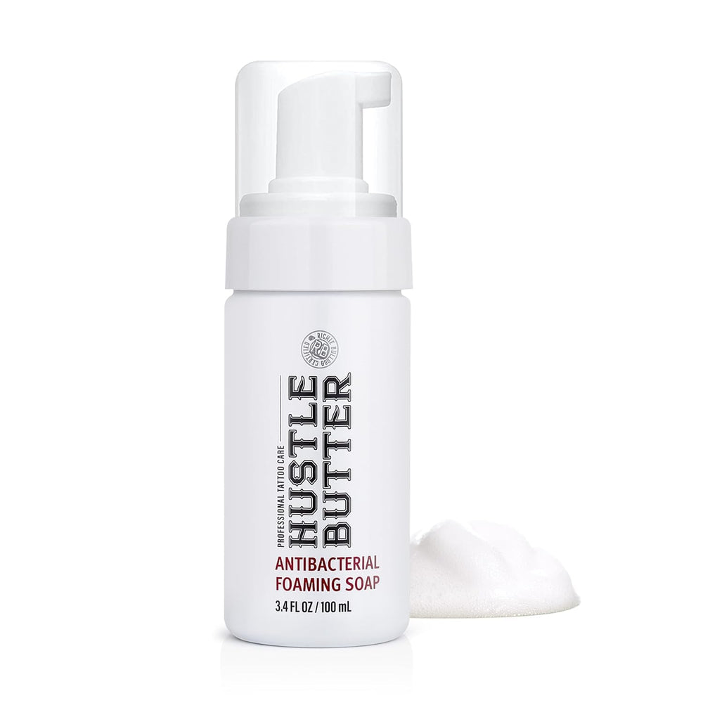 Hustle Bubbles tattoo soap bottle with foam dispenser for gentle cleansing during healing.