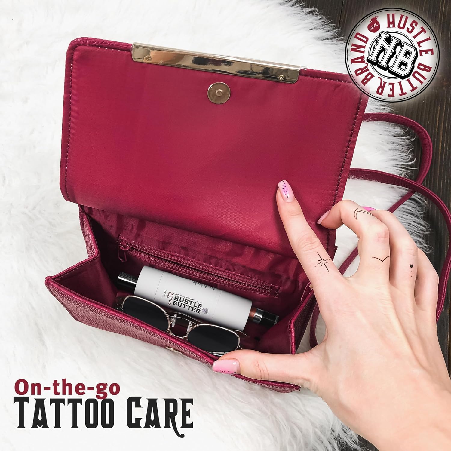 Hustle Butter Deluxe Revitalizing Stick applying to tattoo for on-the-go care