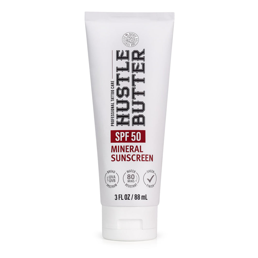 Hustle Butter Deluxe tattoo sunscreen bottle closeup with SPF 50 protection for ink
