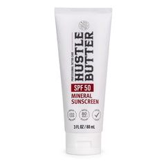 Hustle Butter Deluxe tattoo sunscreen bottle closeup with SPF 50 protection for ink
