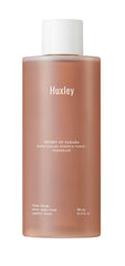 Huxley Conditioning Essence Toner bottle close-up highlighting hydrating, calming skincare routine