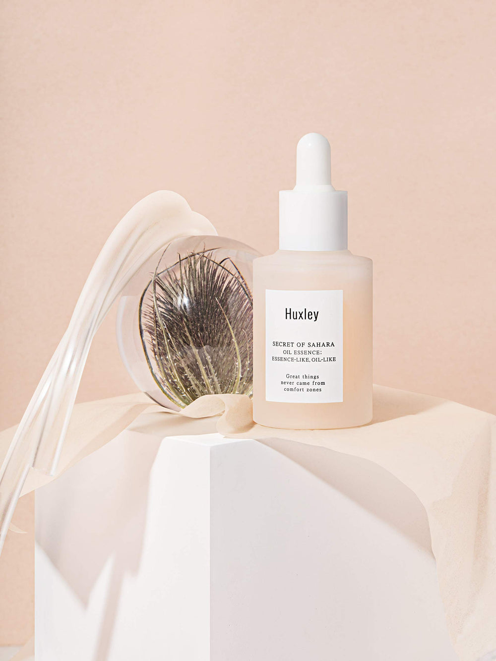 Huxley Secret of Sahara Oil Essence daily hydrating primer usage shot.